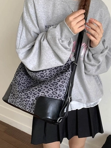 Large leopard print canvas tote bag with black leather straps for autumn fashion style