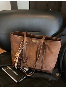 Vintage brown frosted leather tote bag for women with a cute bear charm and shoulder straps