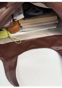 Top view of large capacity brown leather tote bag showing spacious interior compartment