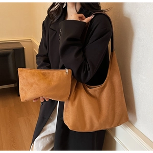 Detailed view of tan suede hobo tote bag set with matching small zipper pouch