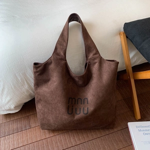 Detail shot of vintage coffee suede tote bag showing soft texture and spacious interior