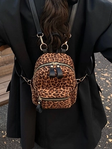 Fashionable leopard print backpack for women with gold zippers and adjustable black straps