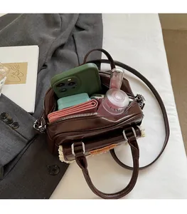 Spacious interior of a vintage brown leather Boston bag showing large storage capacity