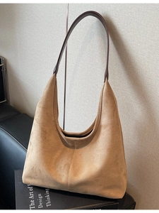 Retro tan faux suede hobo bag with dark leather strap and spacious commuter design