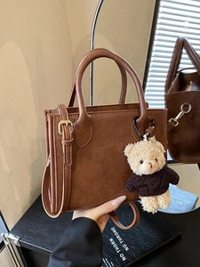 Retro brown textured PU leather handbag with cute teddy bear charm and gold hardware strap