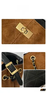 Detail of quilted leather patchwork and vintage golden twist lock on tote bag