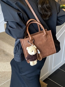 Vintage dark brown faux leather tote bag with a cute bear charm and adjustable strap