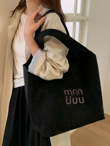 Classic black suede large capacity tote bag for women featuring a minimalist shoulder design