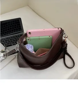 Detailed view showing the spacious interior of this vintage brown leather tote bag