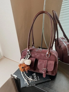 Vintage burgundy Boston shoulder bag with dual pockets and a cute teddy bear charm
