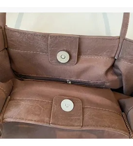 Detail view of large tote bag interior with magnetic clasp and zipper pocket
