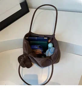 Top-down view showing internal storage capacity of the large brown leather tote bag