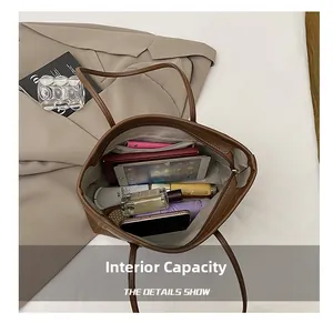 Spacious interior of a brown minimalist tote bag showing tablet and daily essentials
