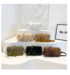 Close-up of six stylish crossbody bags in various colors with geometric patterned flaps
