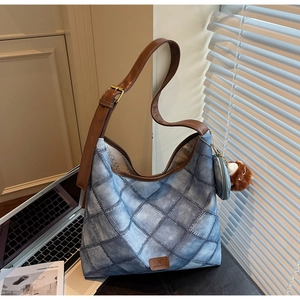 Blue denim texture tote bag featuring diamond quilting, leather strap, and cute charms