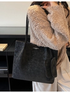 Retro black oversized suede tote bag with shoulder straps and matching mini pouch