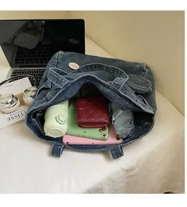 Top view of spacious denim tote bag showing interior storage for tablet and daily items