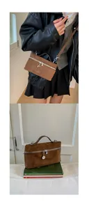 Detail of coffee brown suede leather vanity bag with metal zipper and adjustable strap