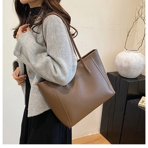 Brown leather tote bag for women showing large capacity and stylish shoulder straps