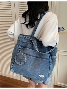 Large blue denim tote bag with circular coin purse and Good Luck text decoration