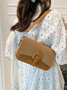 Chic brown patchwork shoulder bag with woven texture and leather details for women