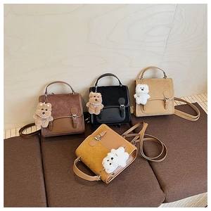 Detail showing vintage quilted crossbody bags in brown, black, beige and yellow hues