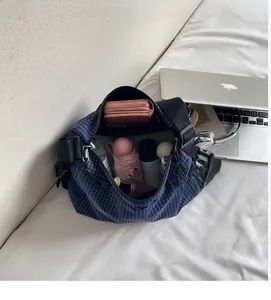 Internal view of the blue checkered tote bag showing its large storage capacity