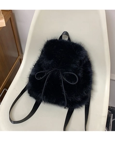 Detail view of fluffy black faux fur backpack with decorative drawstring ribbon bow
