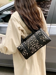 Fashionable black leather shoulder bag with silver rivets and large capacity for women