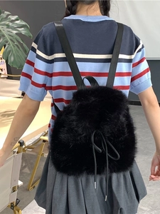Chic black faux fur drawstring backpack with plush texture for stylish winter casual wear