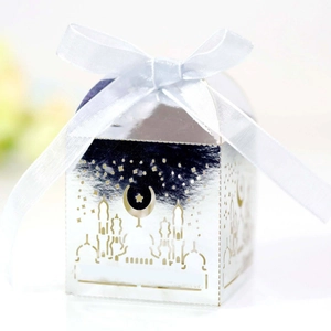 Elegant hollow silver gift box with moon and star cutout patterns and white ribbon