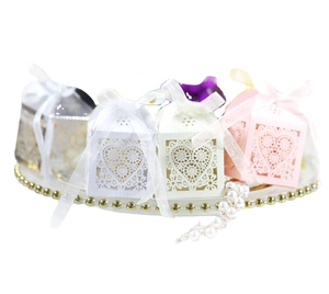 Laser-cut heart-shaped candy boxes with satin ribbons for wedding and party favors