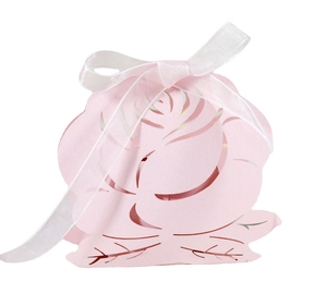 Pink laser-cut rose wedding favor box with ribbon and green leaf base details