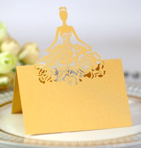 Golden laser-cut place card with crown girl silhouette for wedding table decor