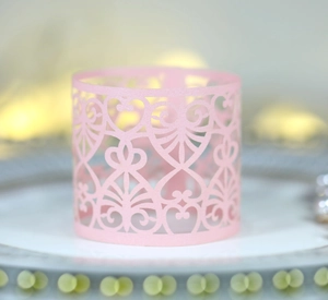Pink laser cut paper napkin ring with heart and vine pattern for wedding table decor