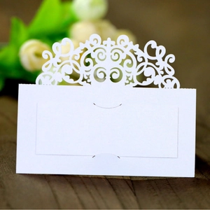 Elegant white laser-cut wedding place cards with European lace patterns for table settings