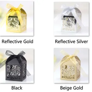Elegant laser-cut gift candy boxes with ribbons in gold, silver, black, and champagne
