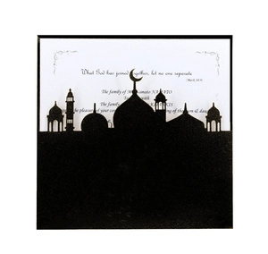 Detail of laser-cut black mosque silhouette and crescent moon on the invitation card