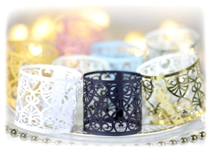 Laser cut hollow paper napkin rings with elegant heart patterns in assorted colors
