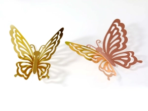Detailed close-up of 3D metallic gold and rose gold hollow-out butterfly wall stickers