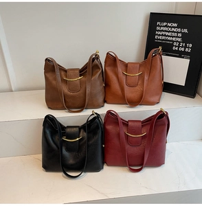 Detailed display of four retro crossbody bags with golden moon buckles in various colors