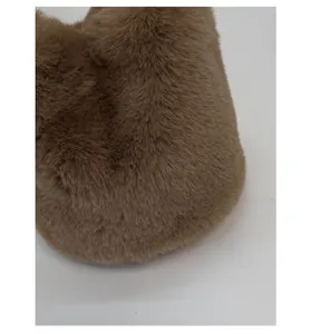 Macro shot of soft khaki brown plush material with fine texture on a bucket bag