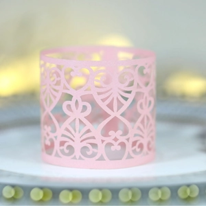 Pink heart laser cut paper napkin ring with elegant floral hollow out pattern