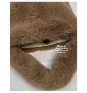 Close-up of secure magnetic closure and smooth lining on brown faux fur bucket bag