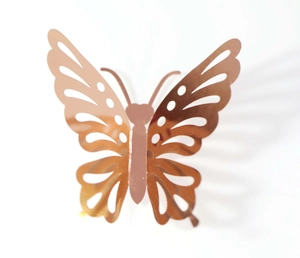 Detail of 3D hollow butterfly wall sticker with elegant rose gold metallic finish