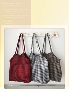 Detailed view of three houndstooth pattern tote bags in red, black, and coffee colors