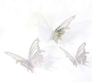 Detailed macro view of 3D metallic silver hollow butterfly wall stickers set of three