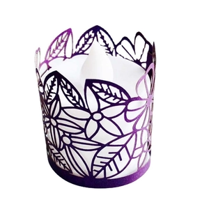 Purple laser-cut paper tea light wrap with floral patterns and LED candle inside