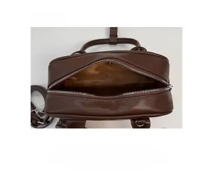Top-down view showing internal storage and lining of the brown retro crossbody bag