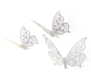 Detailed view of 3D silver hollow butterfly wall decals with metallic texture finish